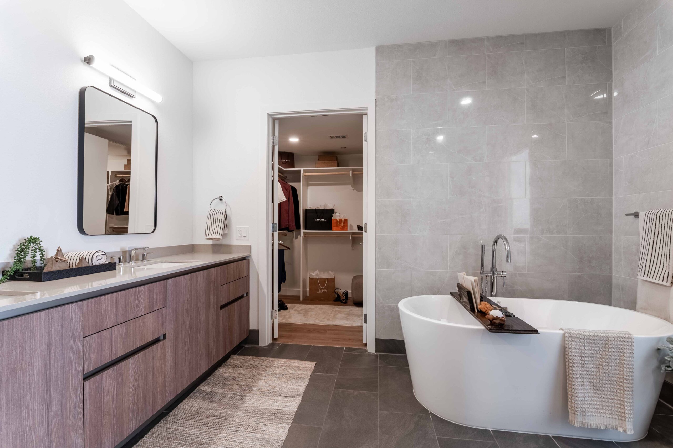 Modern bathroom with tub and closet
