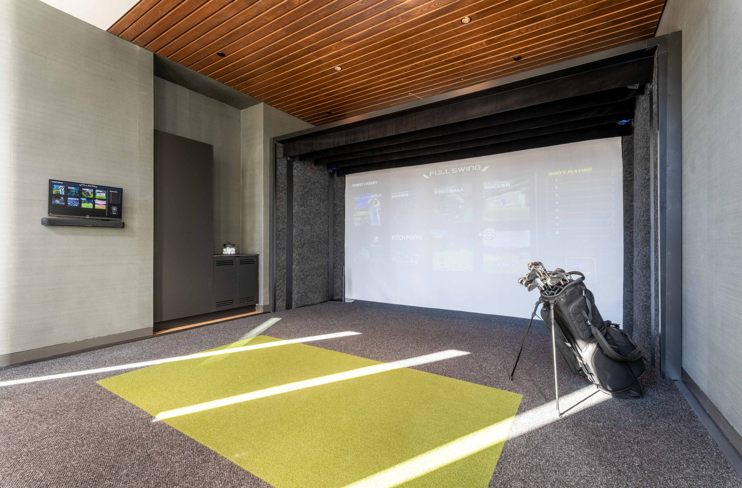 Indoor golf simulator with equipment
