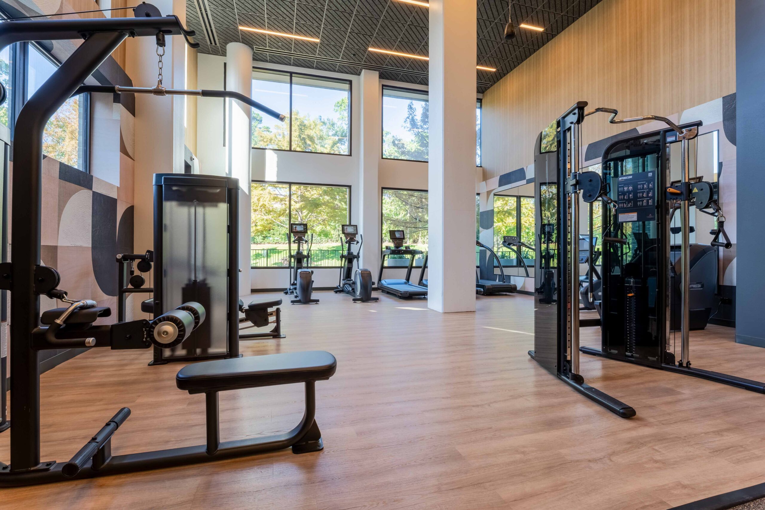 Modern gym with various equipment.