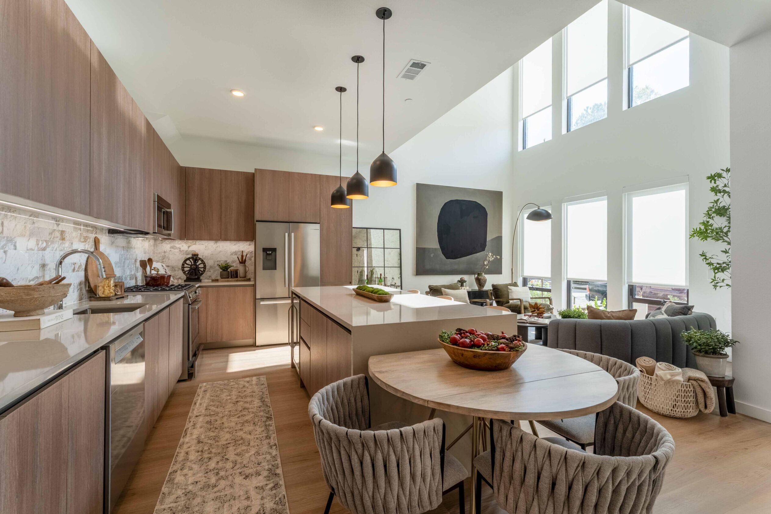 Modern kitchen with bright living area