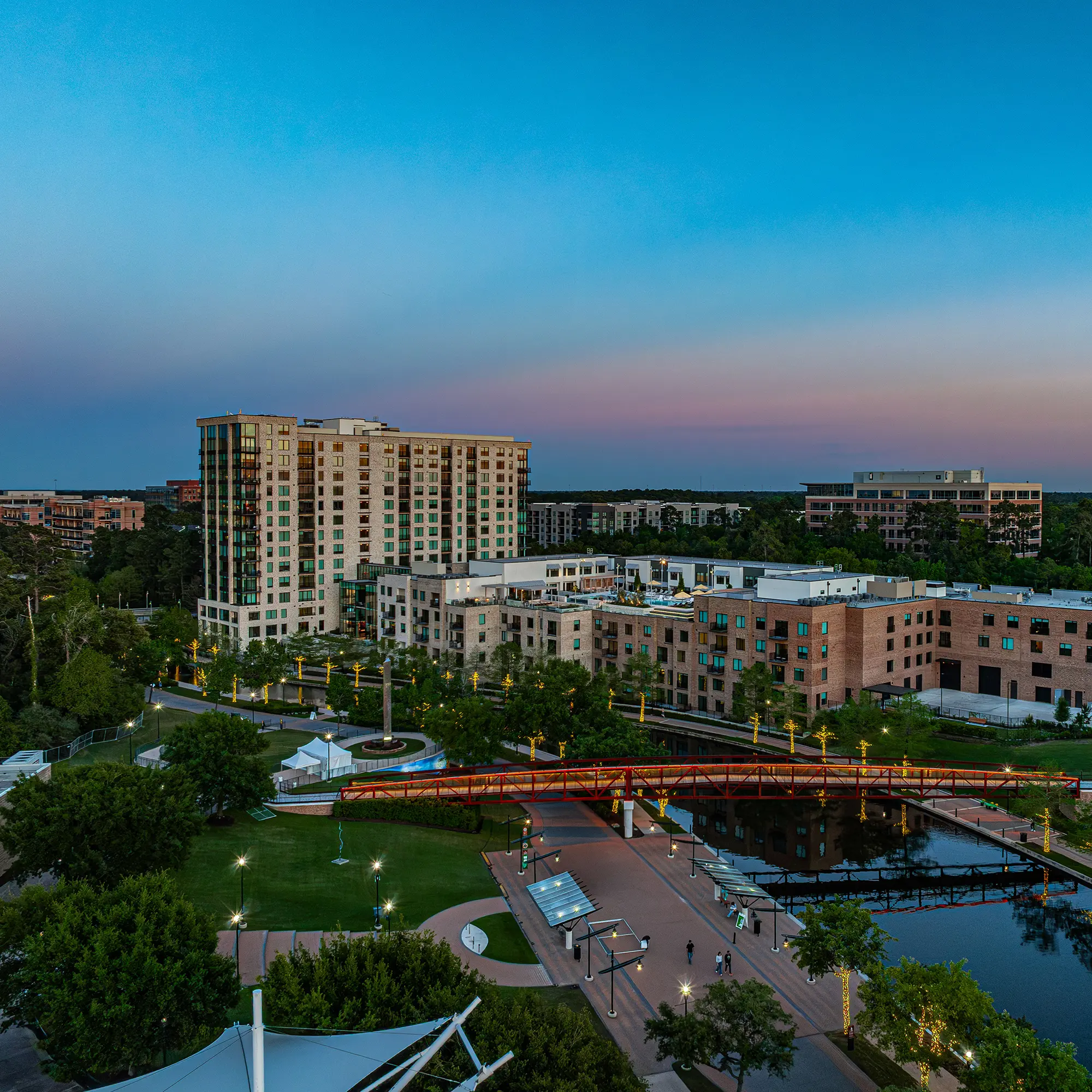 Modern buildings near a serene lake